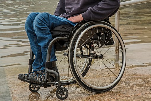 man on chairwheel