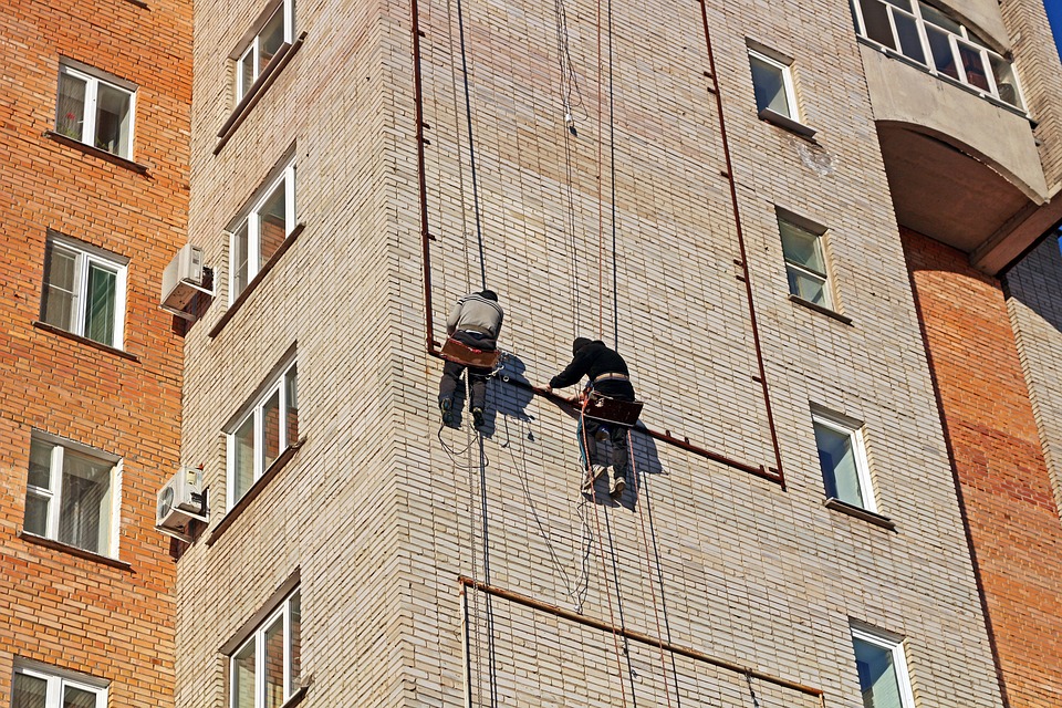 men climbing building